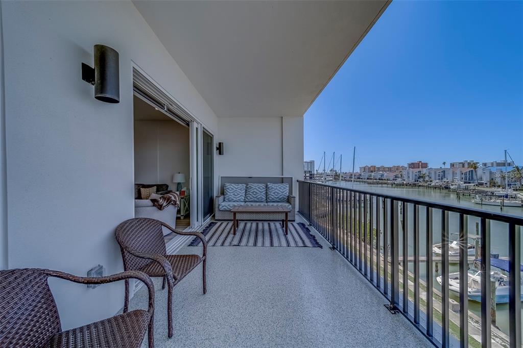 400 150th Avenue, Unit 301 Madeira Beach, FL 33708 - Photo 32 of 66 a view of a balcony and chairs