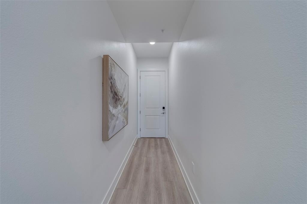 400 150th Avenue, Unit 301 Madeira Beach, FL 33708 - Photo 4 of 66 a view of wooden floor