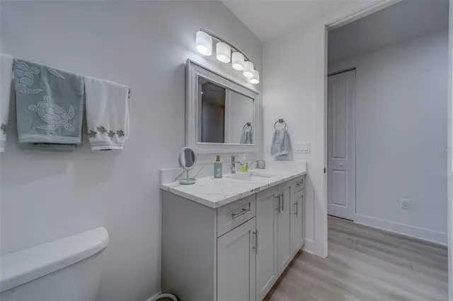 a utility room with cabinets washer and dryer