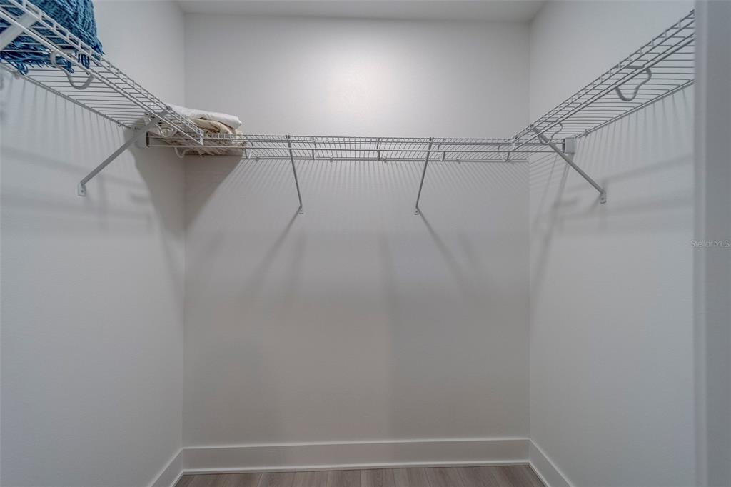 400 150th Avenue, Unit 301 Madeira Beach, FL 33708 - Photo 42 of 66 a view of a room with racks on the wall