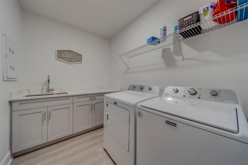 400 150th Avenue, Unit 301 Madeira Beach, FL 33708 - Photo 50 of 66 a utility room with dryer and washer