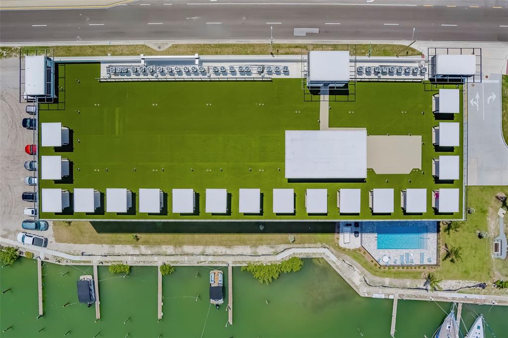 400 150th Avenue, Unit 301 Madeira Beach, FL 33708 - Photo 52 of 66 a view of swimming pool with outdoor seating