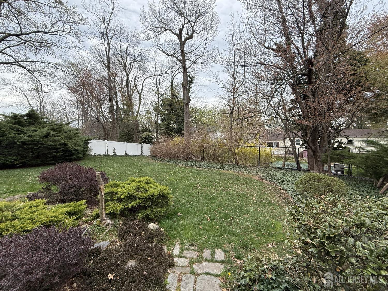 15 Cutter Avenue Edison, NJ 08820 - Photo 18 of 32 a view of a backyard with large trees