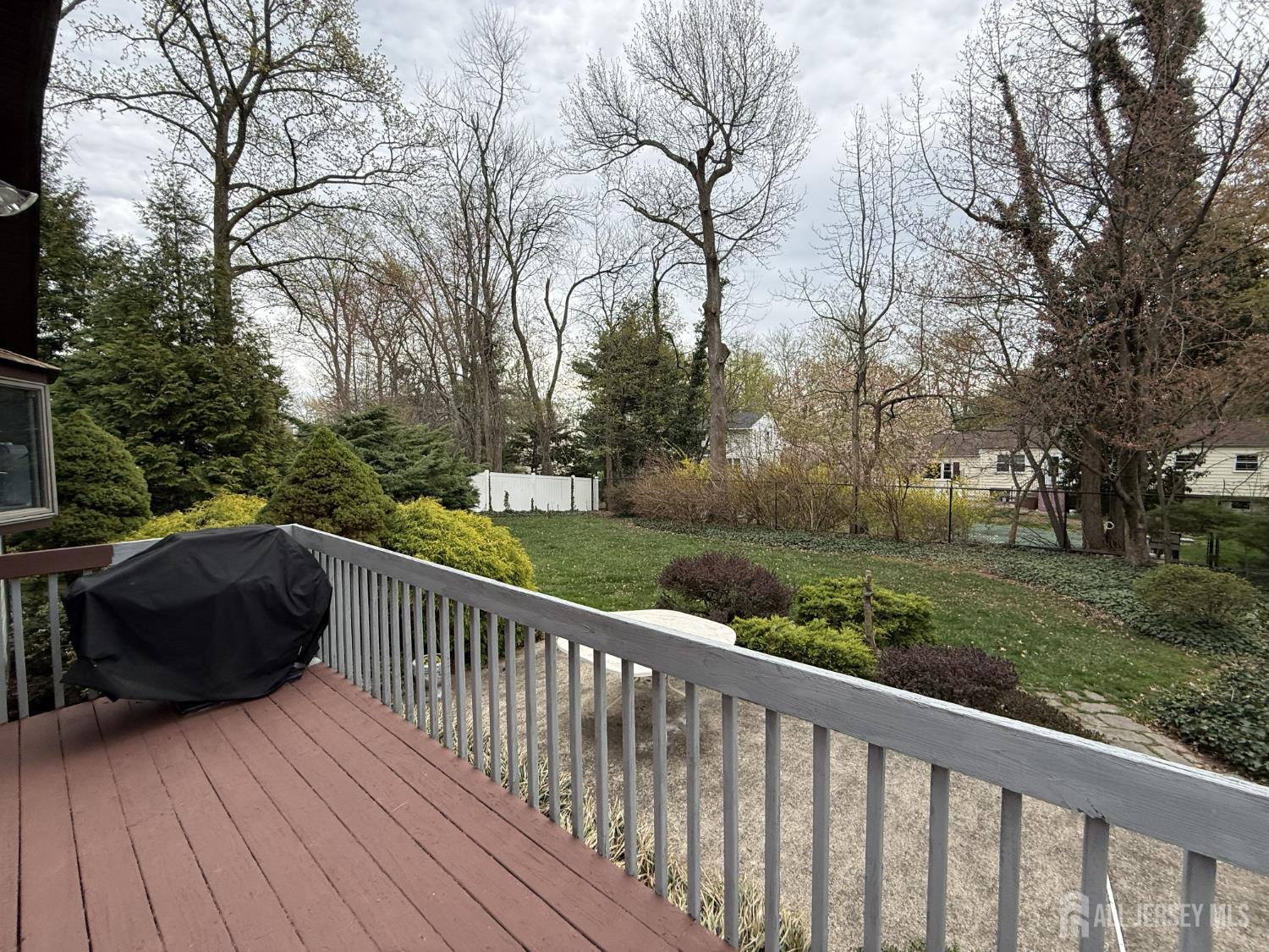 15 Cutter Avenue Edison, NJ 08820 - Photo 23 of 32 a view of deck and yard with trees