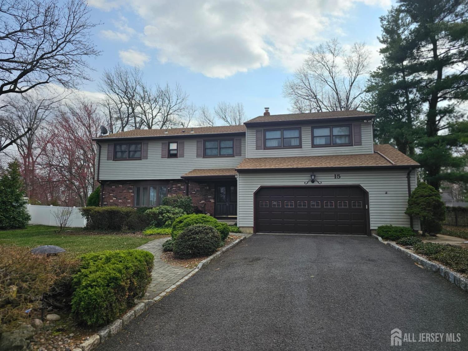 15 Cutter Avenue Edison, NJ 08820 - Photo 27 of 32 a view of a house with a yard and garage
