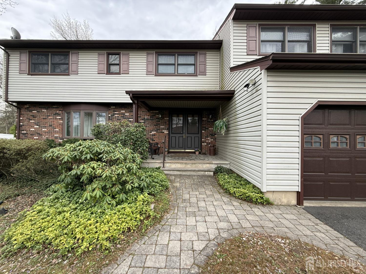 15 Cutter Avenue Edison, NJ 08820 - Photo 31 of 32 a front view of a house with garden