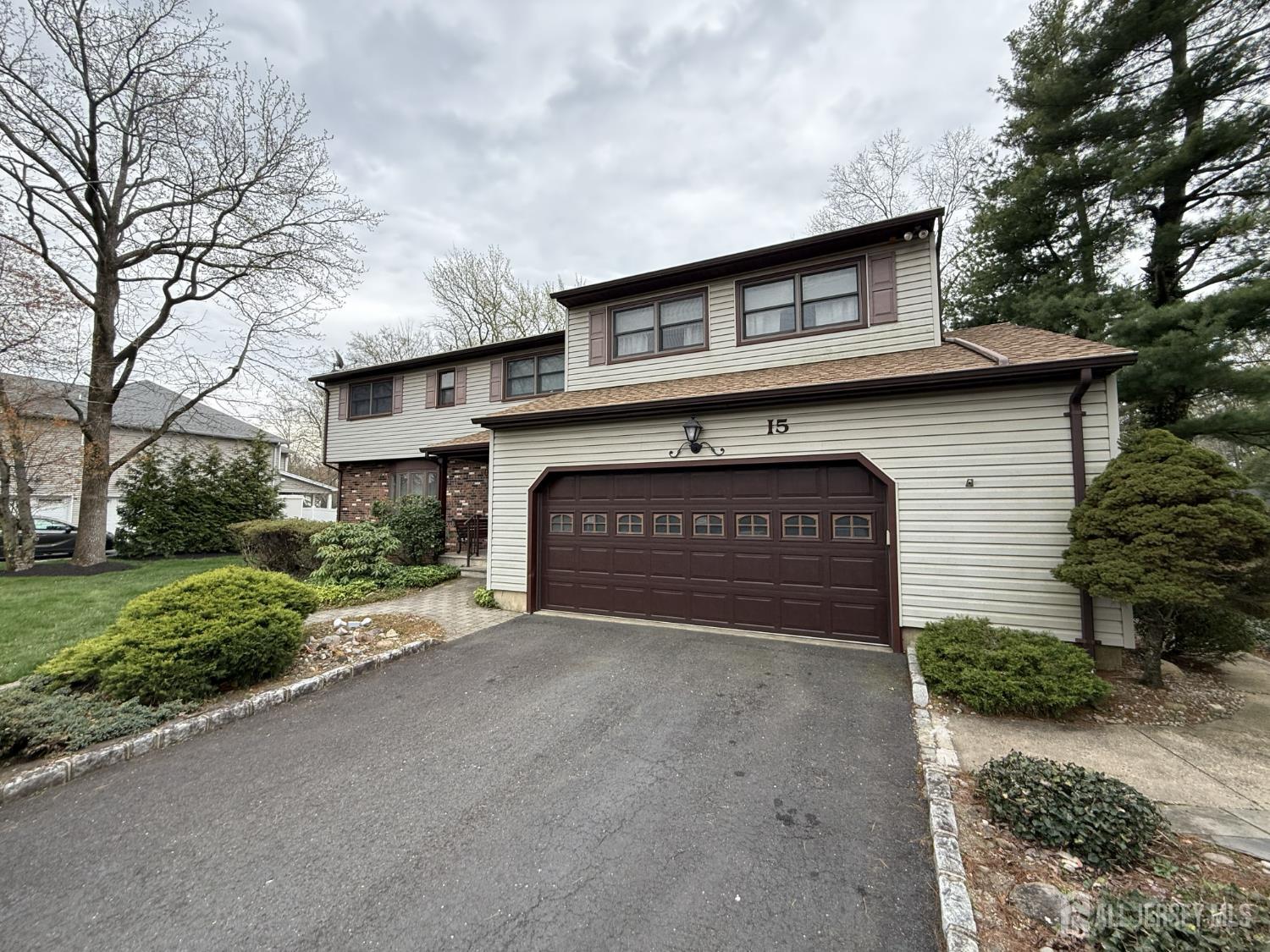 15 Cutter Avenue Edison, NJ 08820 - Photo 32 of 32 a front view of a house with a yard and garage