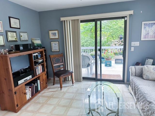 15 Cutter Avenue Edison, NJ 08820 - Photo 5 of 32 a living room with furniture and a flat screen tv