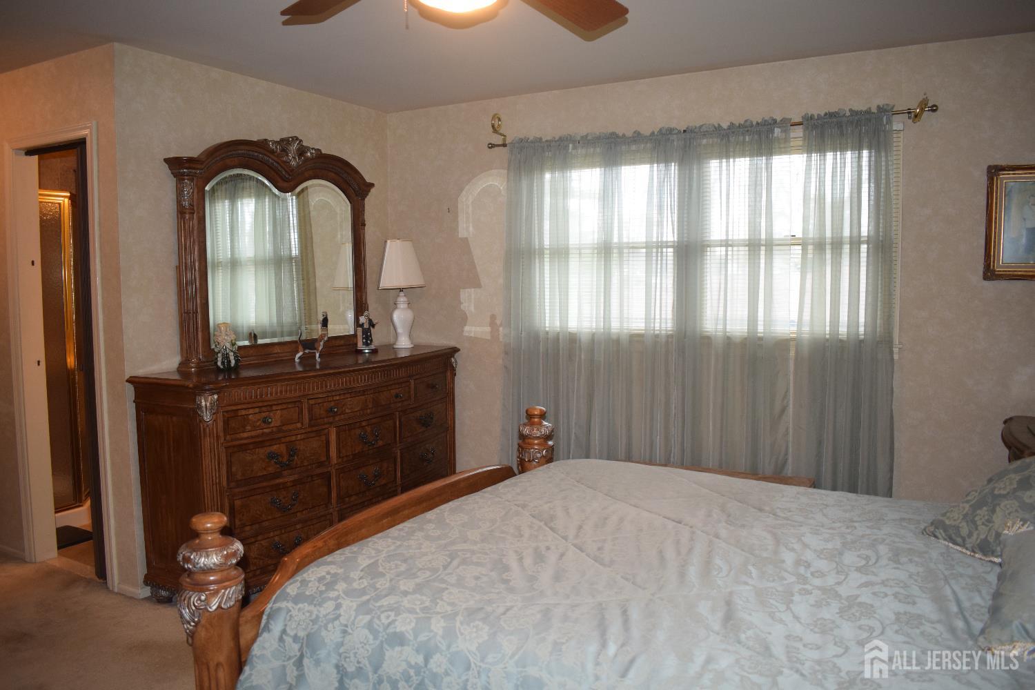 15 Cutter Avenue Edison, NJ 08820 - Photo 8 of 32 a bedroom with a bed and a dresser
