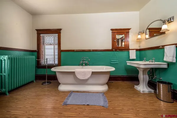 a view of a small house with a backyard