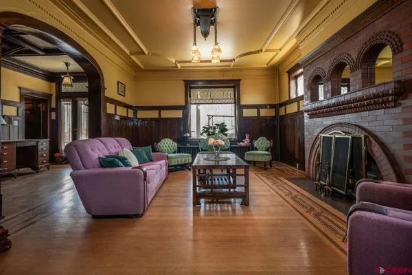 a living room with furniture and a fireplace
