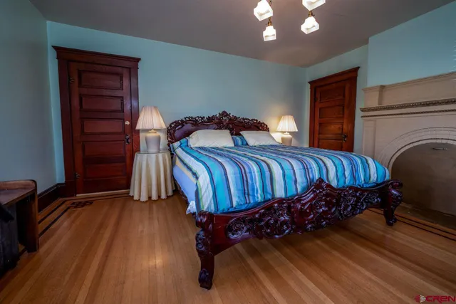 a bedroom with a bed and dresser