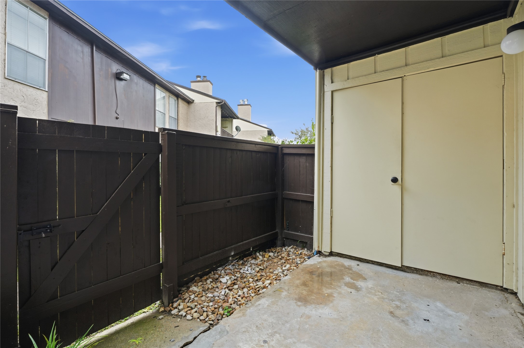 1500 Bay Area Boulevard, Unit 348 Houston, TX 77058 - Photo 9 of 13 Your gated patio opens up to greenspace and a short path to the community pool.