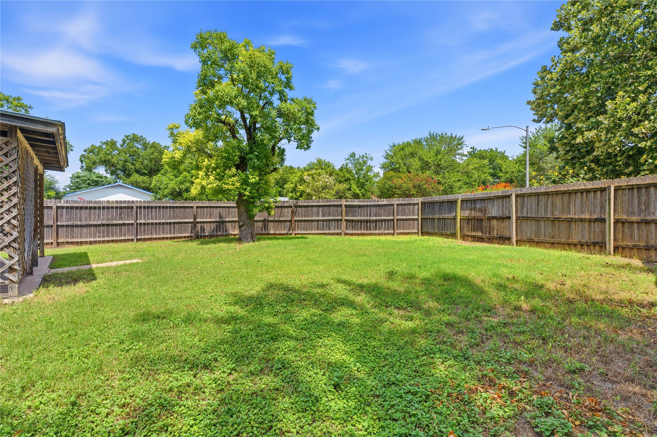 6205 Shadow Bend Austin, TX 78745 - Photo 31 of 31 A spacious, enclosed yard provides ample room for outdoor recreation and privacy.