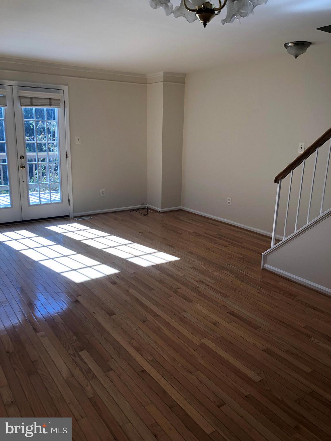 8568 Springfield Oaks Drive Springfield, VA 22153 - Photo 7 of 38 Living Room with hardwoods & Doors to Decks