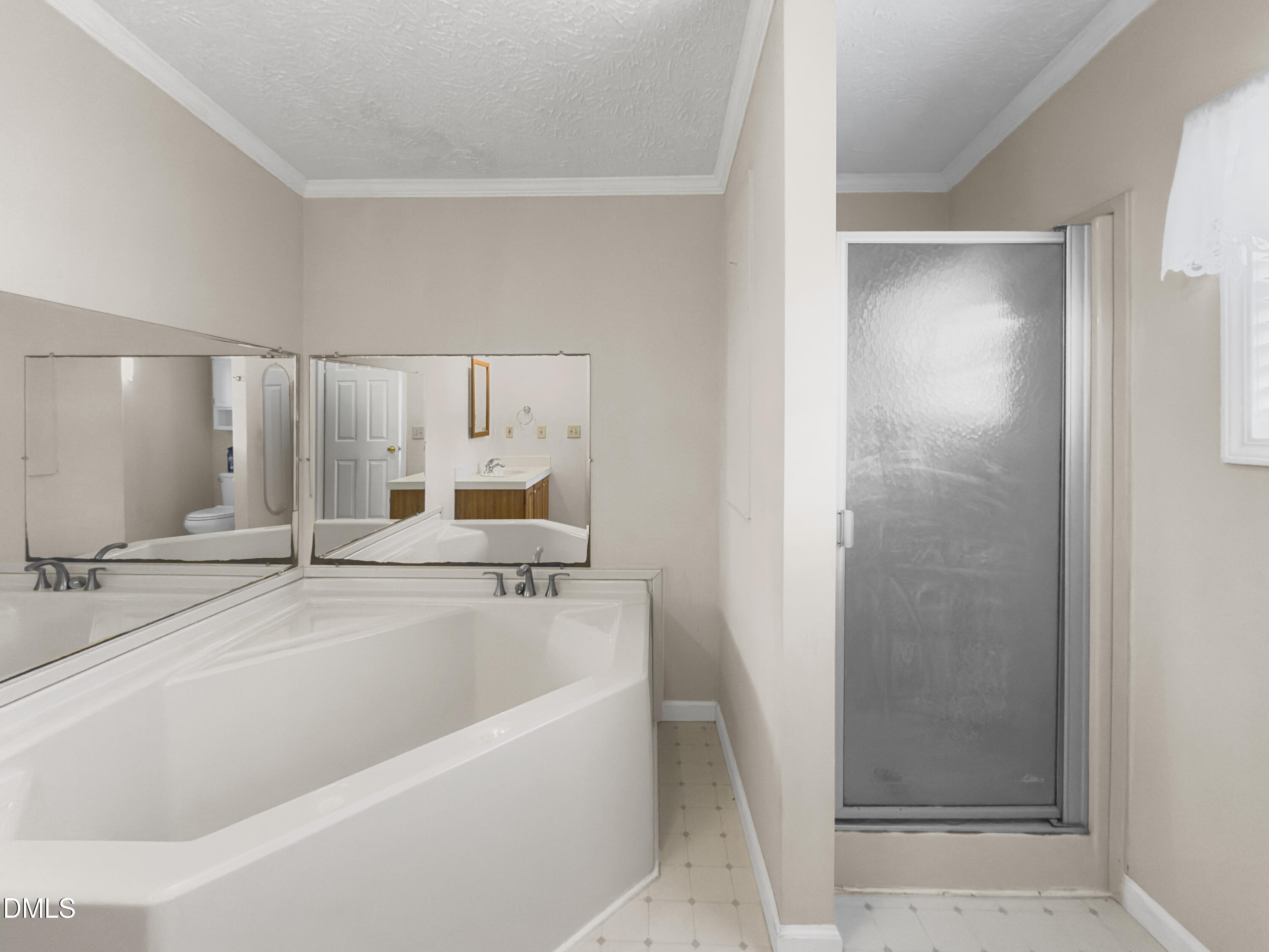 199 Iris Bryant Road Erwin, NC 28339 - Photo 13 of 33 a bathroom with a bathtub and a shower