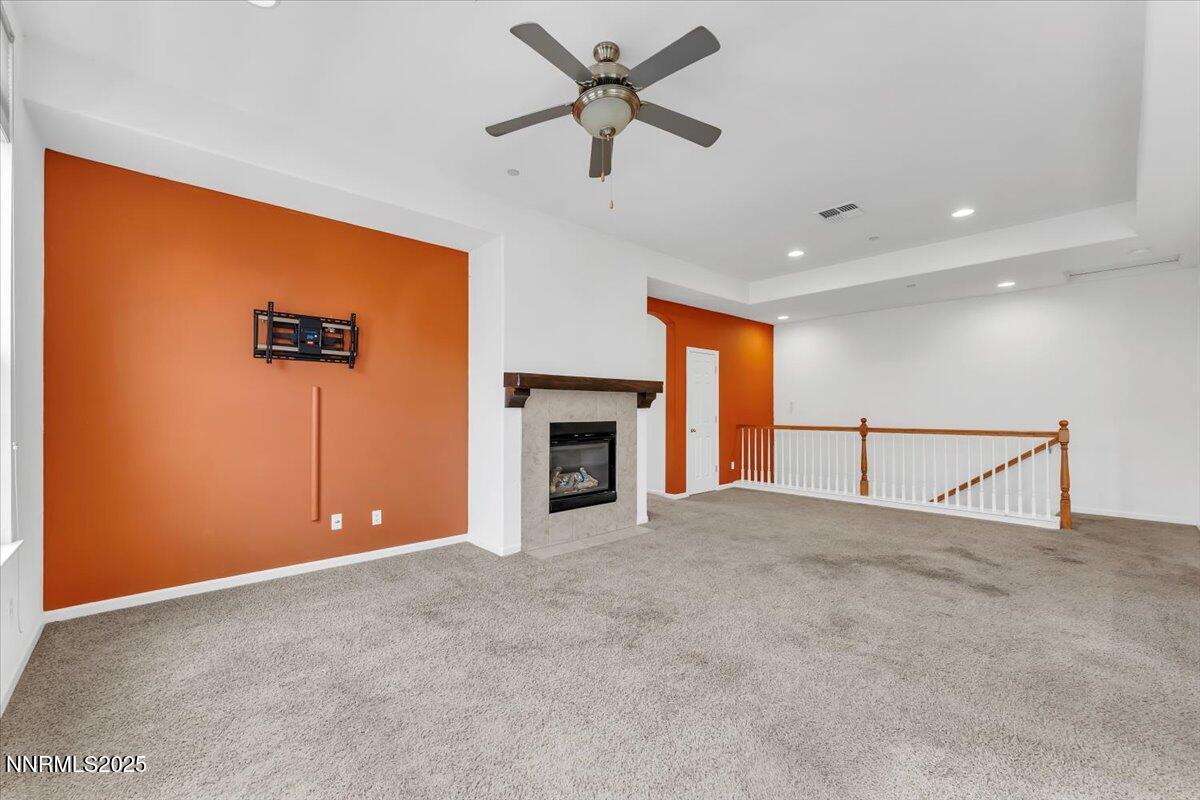 1932 Wind Ranch Road, Unit C Reno, NV 89521 - Photo 16 of 29 a view of an empty room with a fireplace