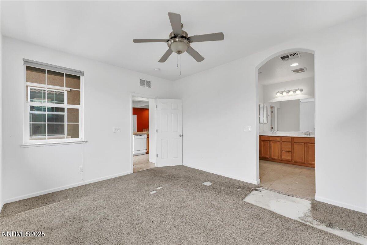 1932 Wind Ranch Road, Unit C Reno, NV 89521 - Photo 23 of 29 an empty room with closet and windows