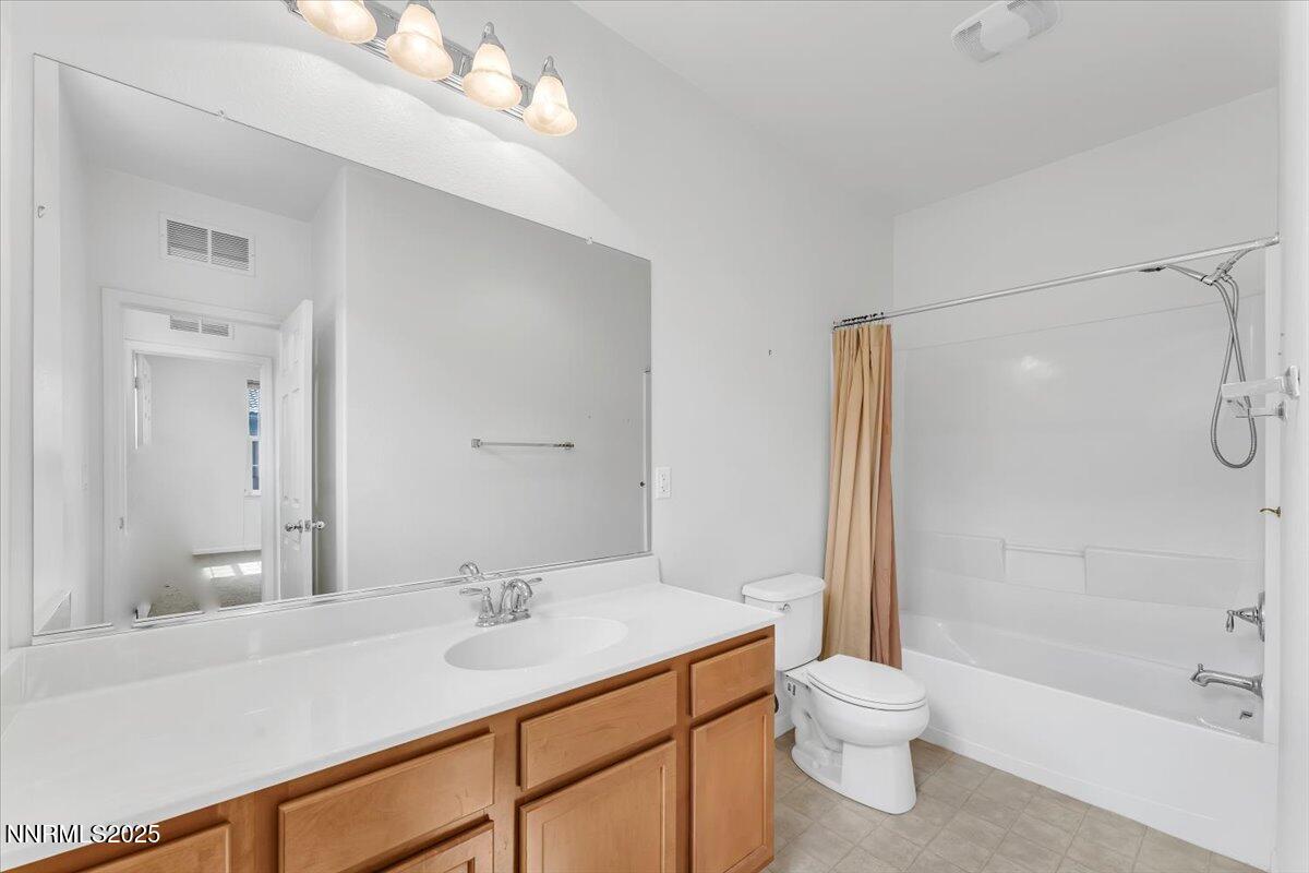 1932 Wind Ranch Road, Unit C Reno, NV 89521 - Photo 27 of 29 a bathroom with a sink a toilet and shower