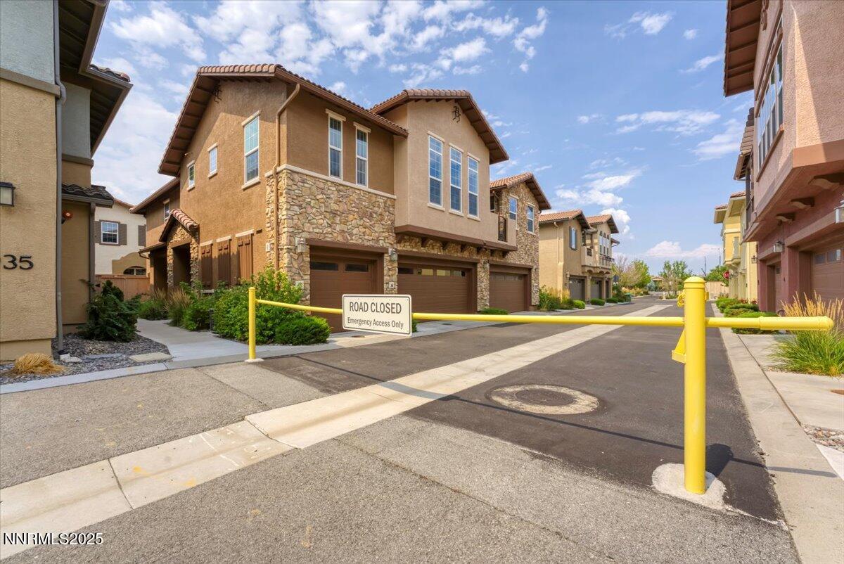 1932 Wind Ranch Road, Unit C Reno, NV 89521 - Photo 5 of 29 a front view of a building with street view