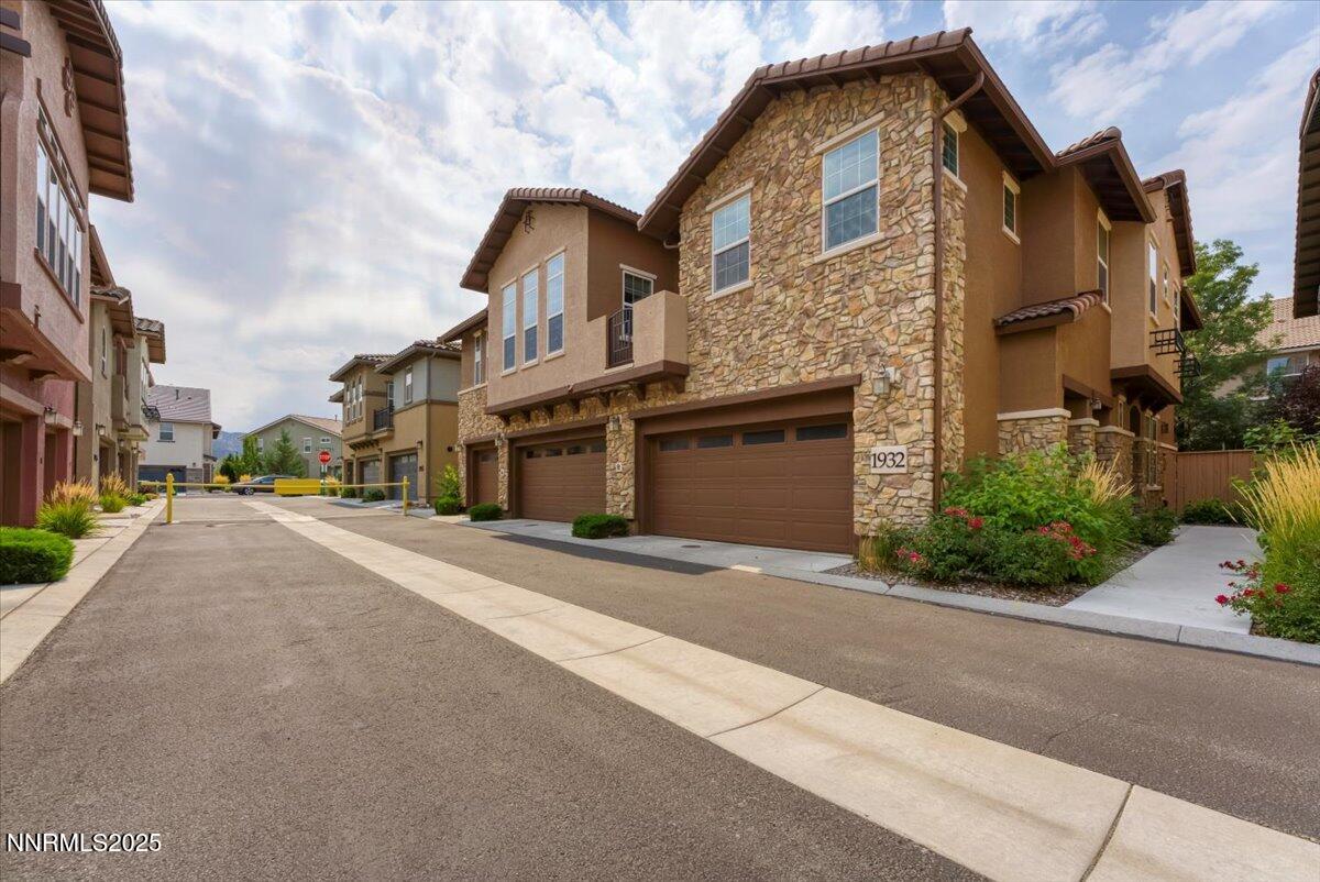 1932 Wind Ranch Road, Unit C Reno, NV 89521 - Photo 7 of 29 a front view of a house with a yard
