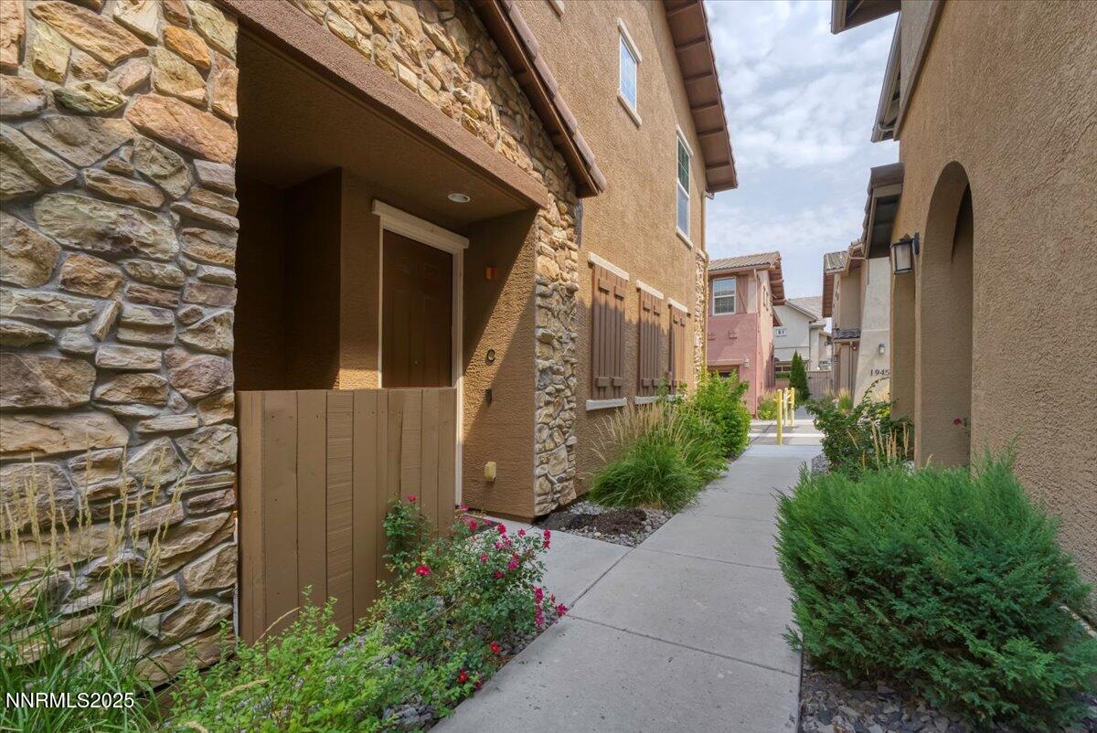 1932 Wind Ranch Road, Unit C Reno, NV 89521 - Photo 10 of 29 a view of a pathway along the building