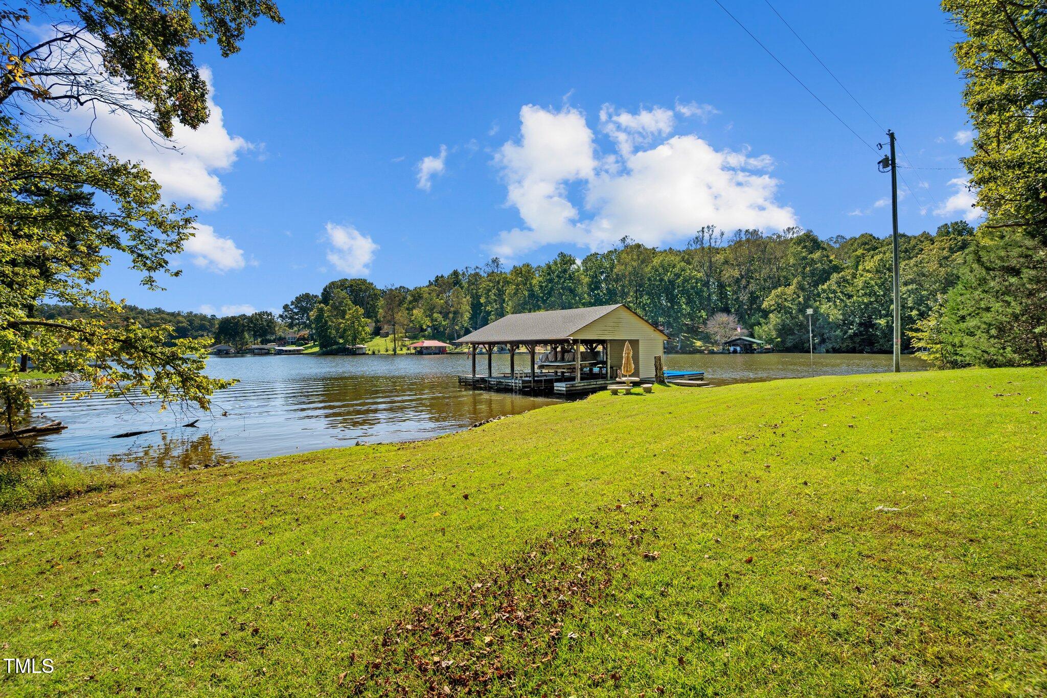 395 Velvet Road Semora, NC 27343 - Photo 11 of 22 Large green lawn along waters edge