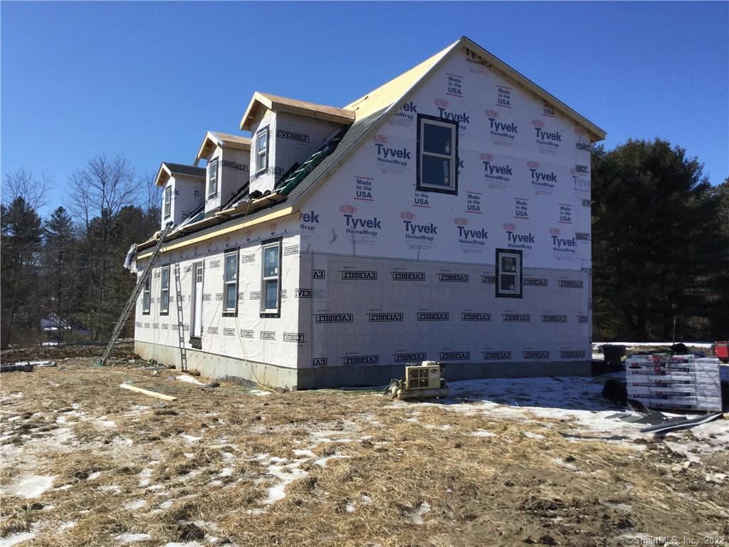 546 East Thompson Road Thompson, CT 06277 - Photo 1 of 1 a front view of a house with a yard