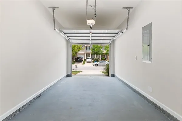 a view of a room with a chandelier and fireplace