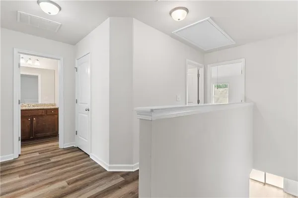 a view of a livingroom with wooden floor and closet