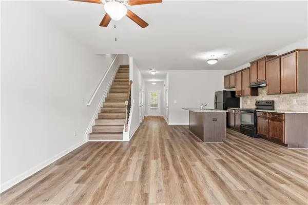 a view of kitchen with sink microwave and stove
