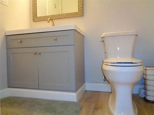 a bathroom with a toilet and a sink