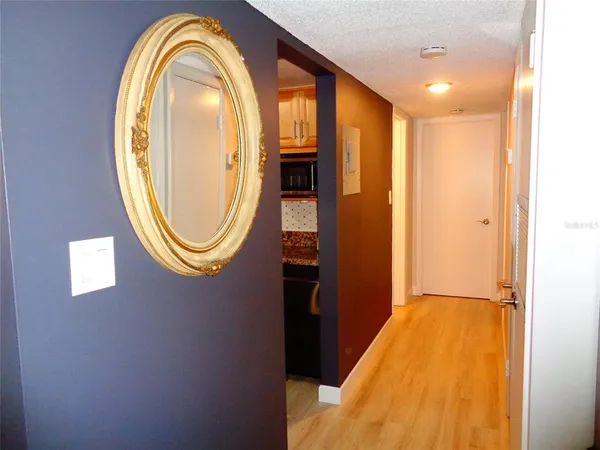 a view of a bathroom with a bathtub and mirror