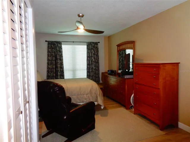 a bed room with a bed and a dresser