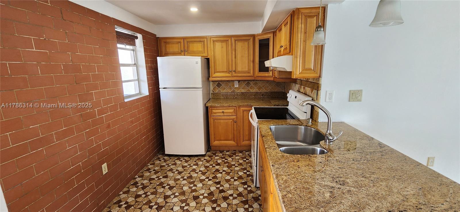 14195 Southwest 87th Street, Unit B306 Miami, FL 33183 - Photo 4 of 13 a bathroom with a sink toilet and shower