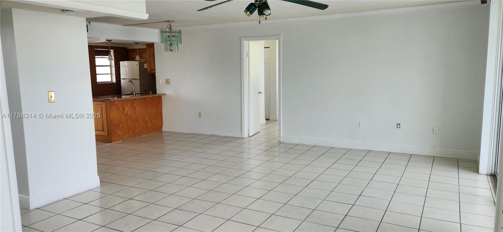 14195 Southwest 87th Street, Unit B306 Miami, FL 33183 - Photo 7 of 13 an empty room with windows