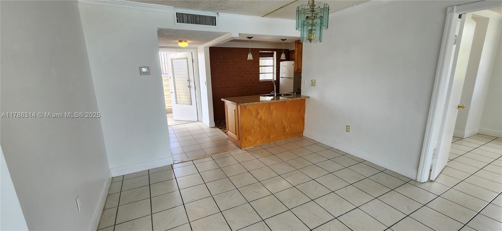 14195 Southwest 87th Street, Unit B306 Miami, FL 33183 - Photo 10 of 13 a view of a utility room with windows