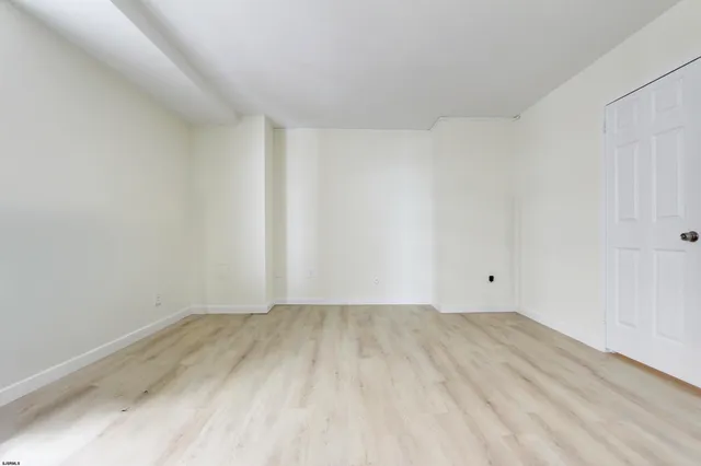 a bathroom with a granite countertop sink mirror vanity and toilet