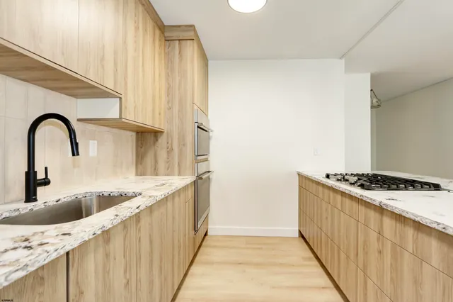 a kitchen with a stove and a sink