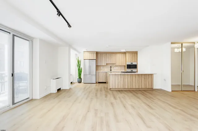 a view of kitchen with wooden floor