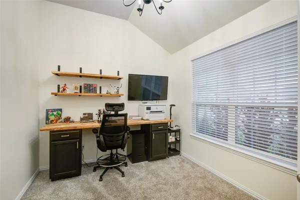 a view of a workspace with furniture