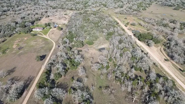 a aerial view of a house with a yard