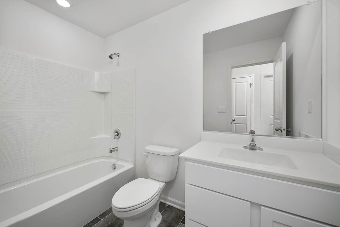 1479 Yosemite Way Pingree Grove, IL 60140 - Photo 13 of 27 a bathroom with a sink a toilet and a bathtub