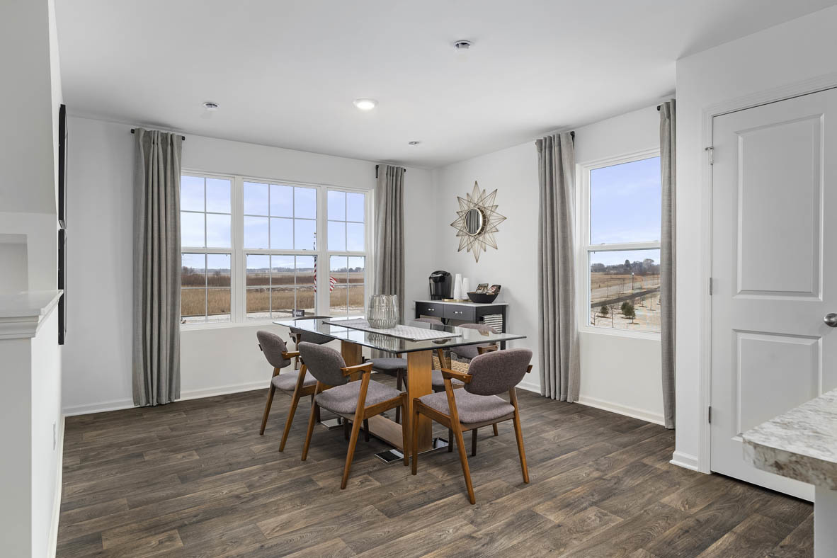 1479 Yosemite Way Pingree Grove, IL 60140 - Photo 15 of 27 a view of a dining room with furniture window and wooden floor