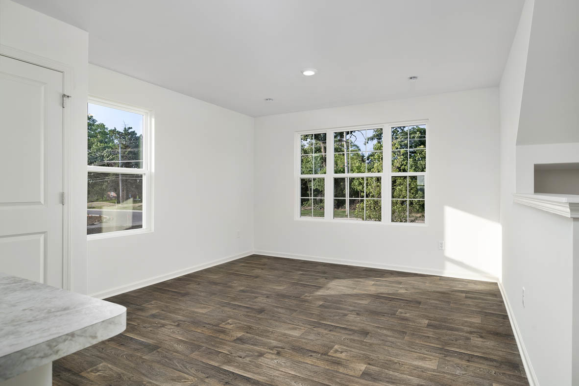 1479 Yosemite Way Pingree Grove, IL 60140 - Photo 2 of 27 a view of an empty room with wooden floor and a window