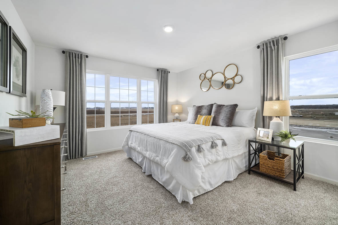 1479 Yosemite Way Pingree Grove, IL 60140 - Photo 22 of 27 a spacious bedroom with a bed and a large window