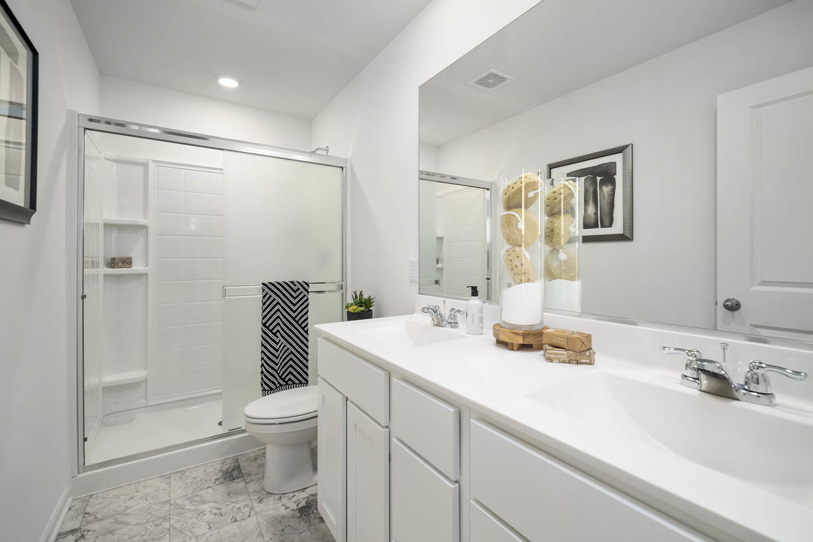 1479 Yosemite Way Pingree Grove, IL 60140 - Photo 23 of 27 a bathroom with a sink toilet and shower