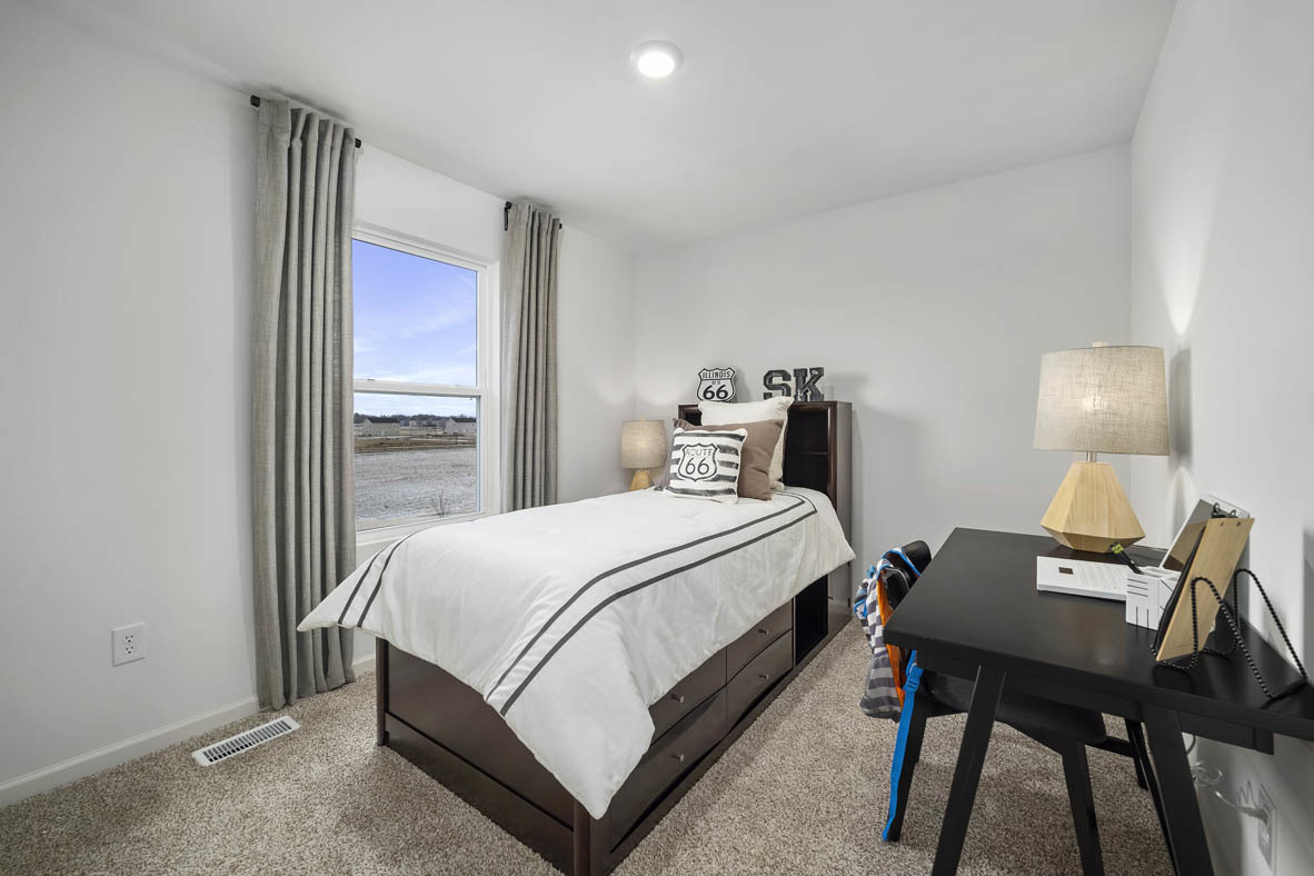 1479 Yosemite Way Pingree Grove, IL 60140 - Photo 24 of 27 a bedroom with a bed and a table in it