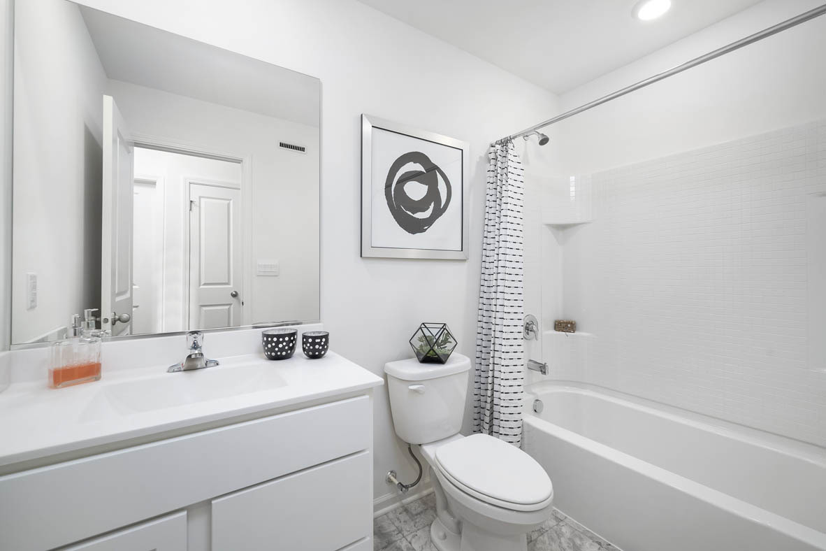 1479 Yosemite Way Pingree Grove, IL 60140 - Photo 26 of 27 a bathroom with a sink a toilet and a bathtub