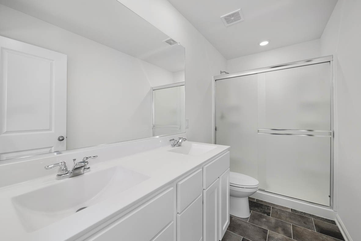 1479 Yosemite Way Pingree Grove, IL 60140 - Photo 10 of 27 a bathroom with a sink toilet and shower